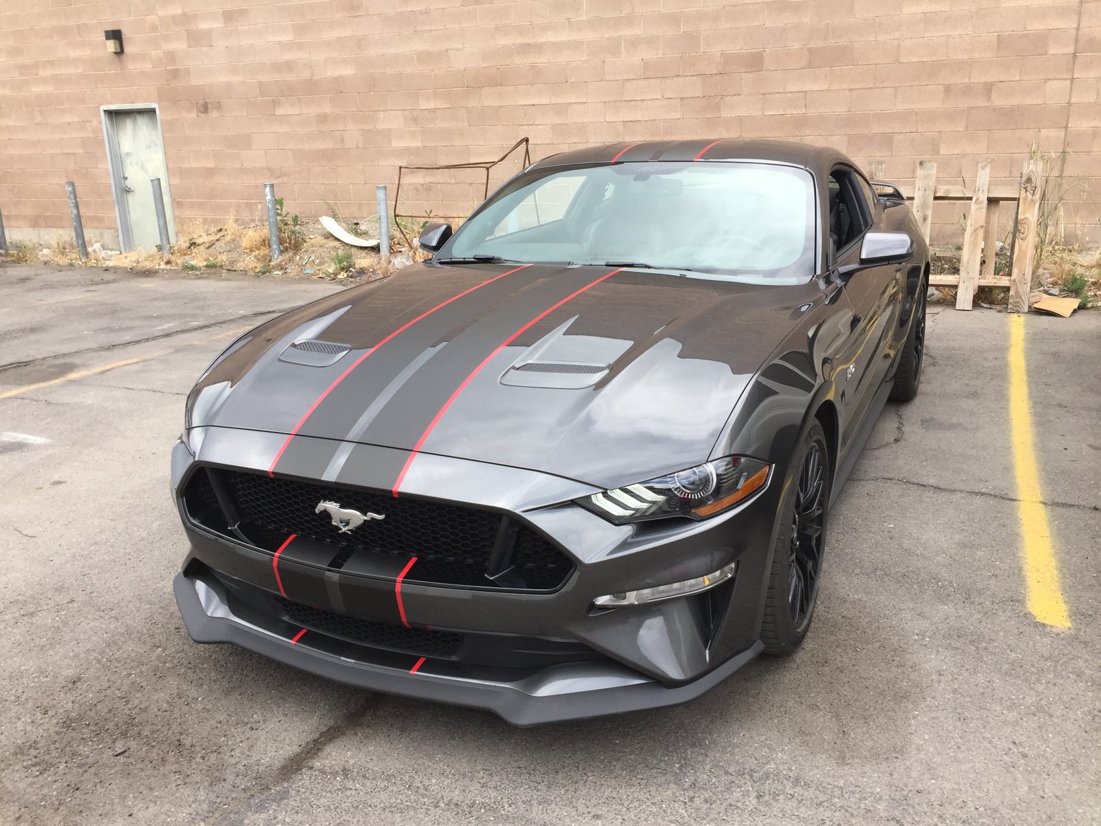 Racing stripe vehicle graphics on a Mustang GT